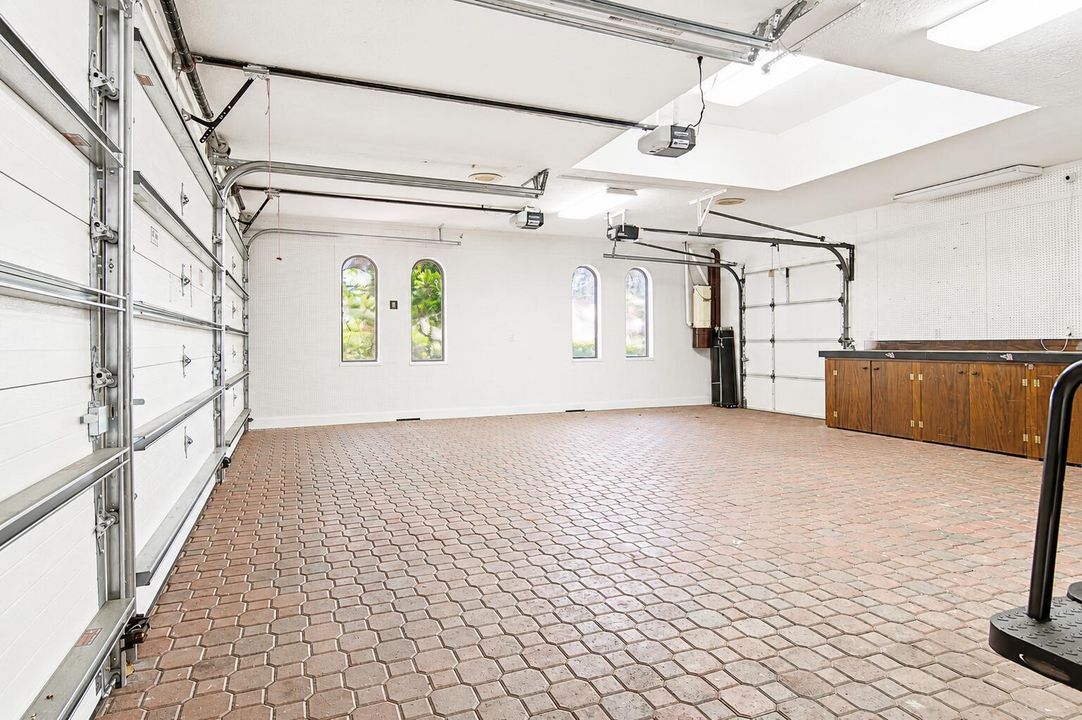 3 car garage with additional golf cart b