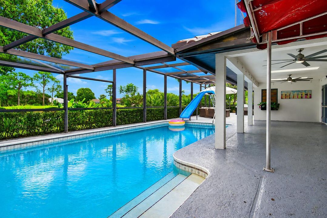 large in ground pool with slide