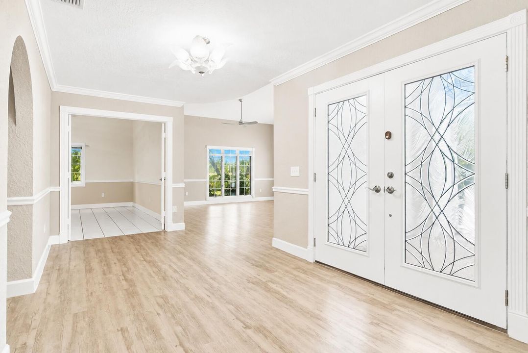 foyer with view of formal living room &