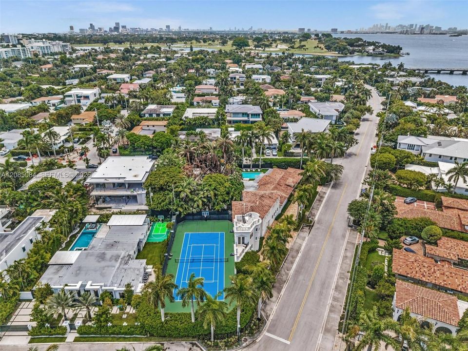 Aerial view of the residence, lawn and sport courts
