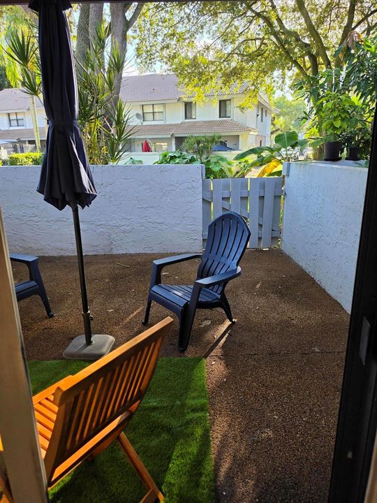 PATIO WITH GATE TO POOL AREA