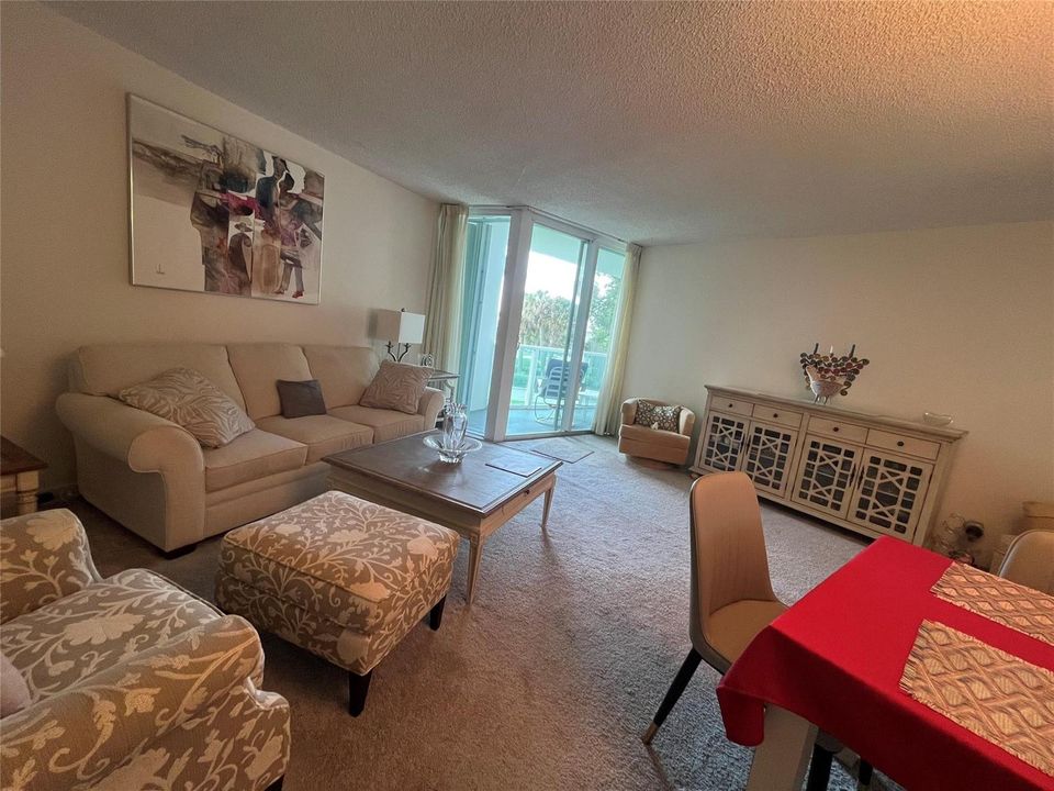 living room and sliders to balcony