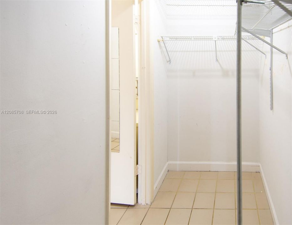 Reverse view of walk-in closet