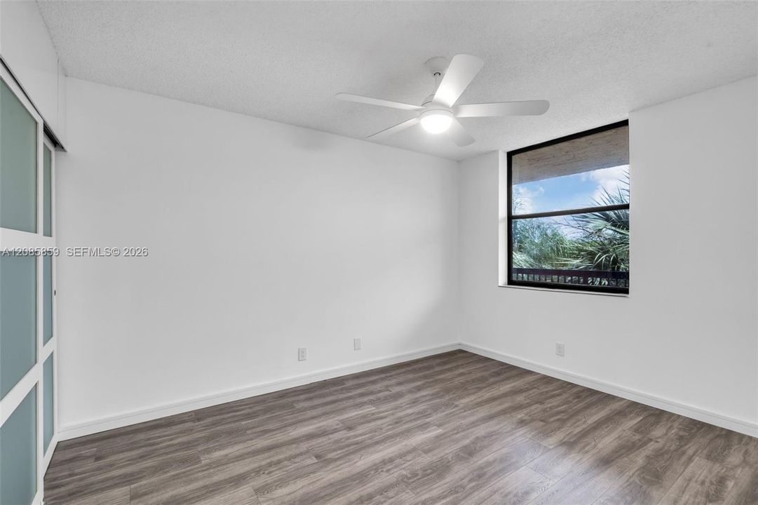 Alternate view of the light-filled bedroom with serene surroundings