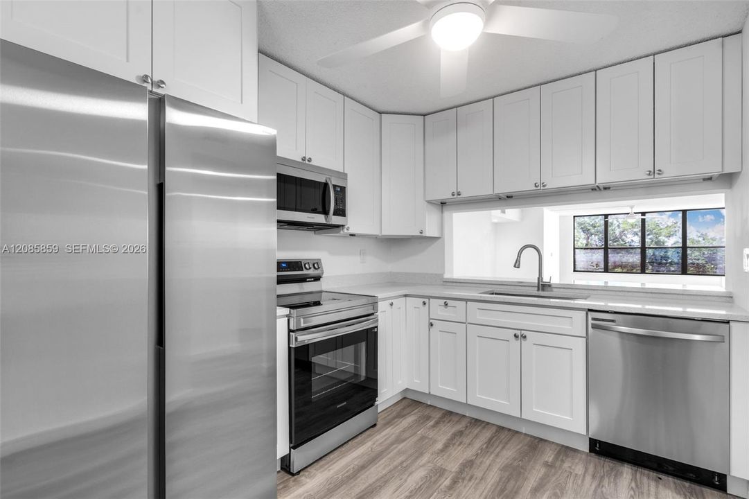 Kitchen with generous counter space, and seamless flow into the adjacent dining area.
