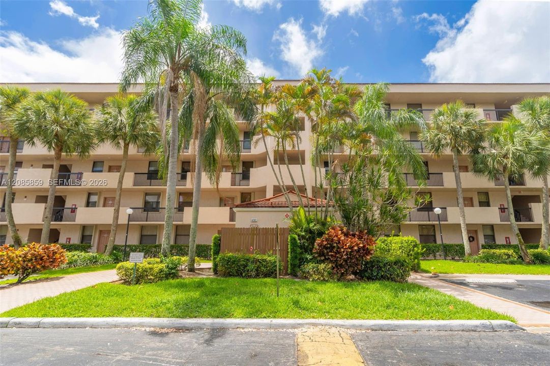 Well-maintained community building surrounded by mature landscaping.