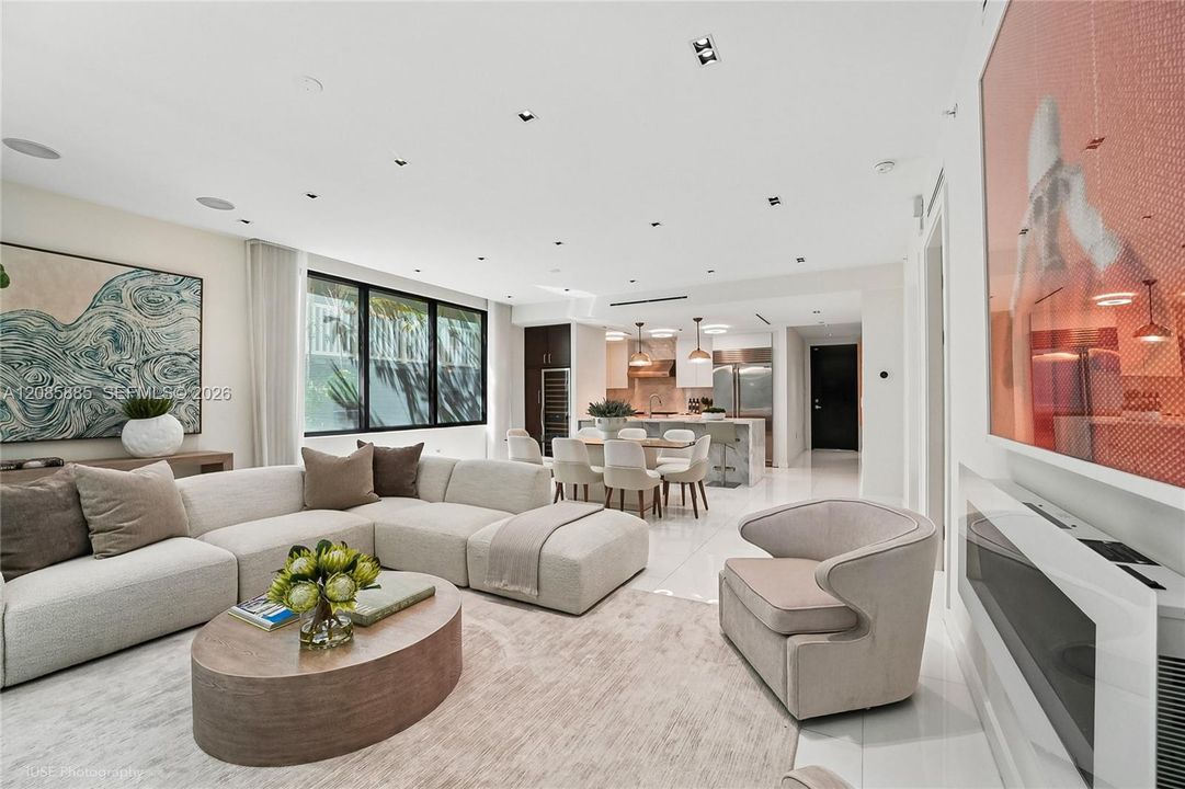 Expansive and effortlessly elegant . Floor to ceiling windows flood the room
