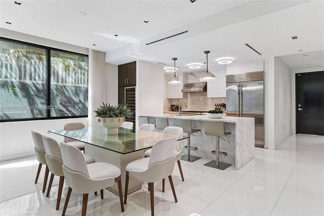 Designed for both effortless living and serious entertaining, this open-concept kitchen is outfitted with high-end appliances and a professional gas stove — a rare find in South Beach's boutique inventory.