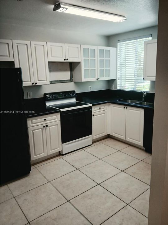 Kitchen to the right of the Foyer
