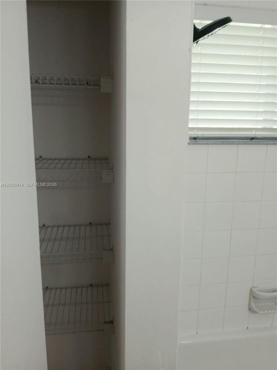 Bath closet behind entrance door