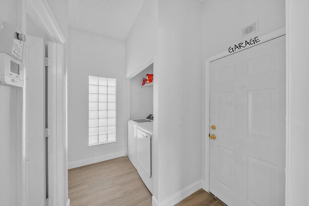 Hallway leading to garage