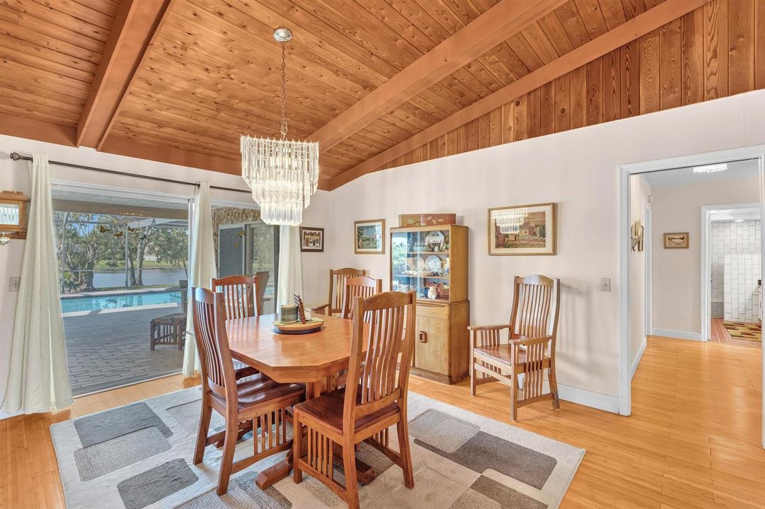 Dining room with view of pool/lake