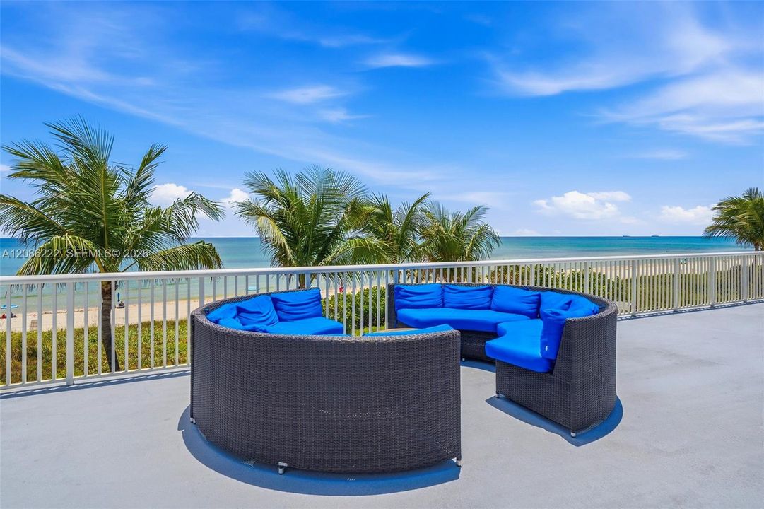 Seating with view of pool and beach