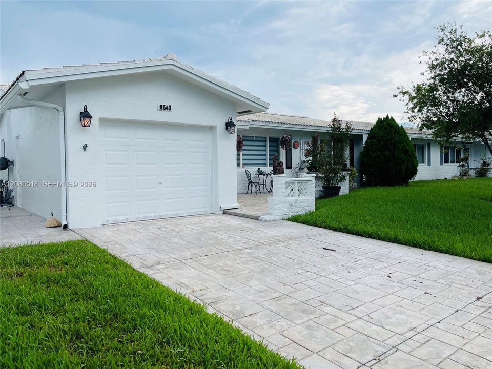 STAMP CONCRETE DRIVEWAY INCLUDING SIDE AREA AND PATIOS