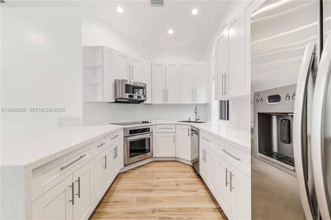 Beautiful floors and impact glass windows and doors.