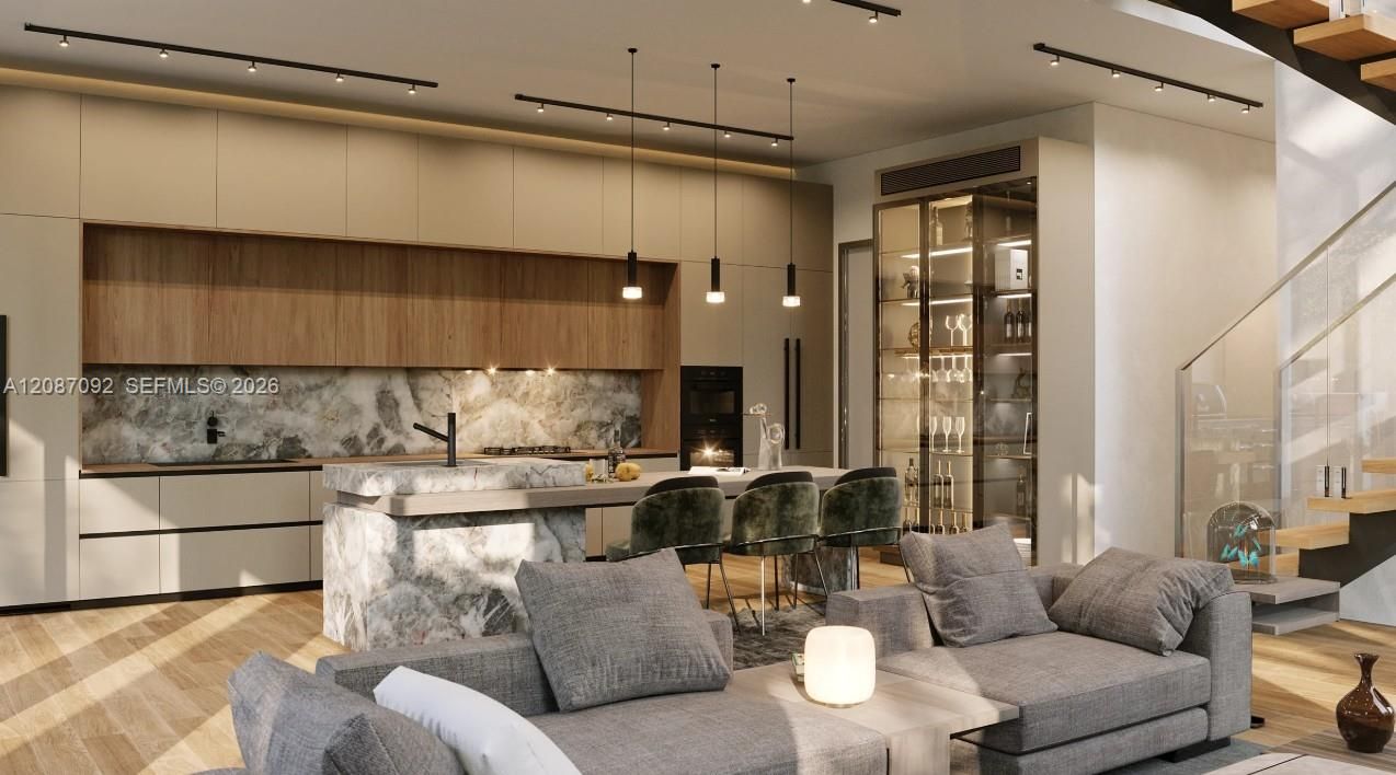 Open-concept living space with wood-finish flooring, a contemporary kitchen featuring integrated appliances and stone slab backsplash, a built-in glass display cabinet, and a modern open-tread staircase with a glass railing