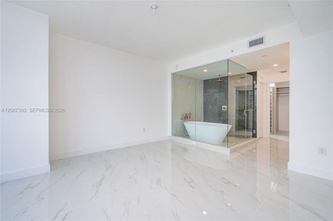 Great master bedroom. Motorized shades and blackout
