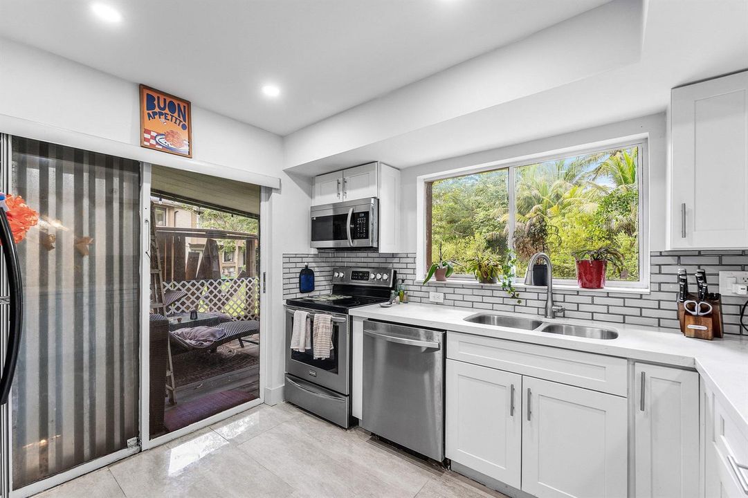 Kitchen with enclosed patio