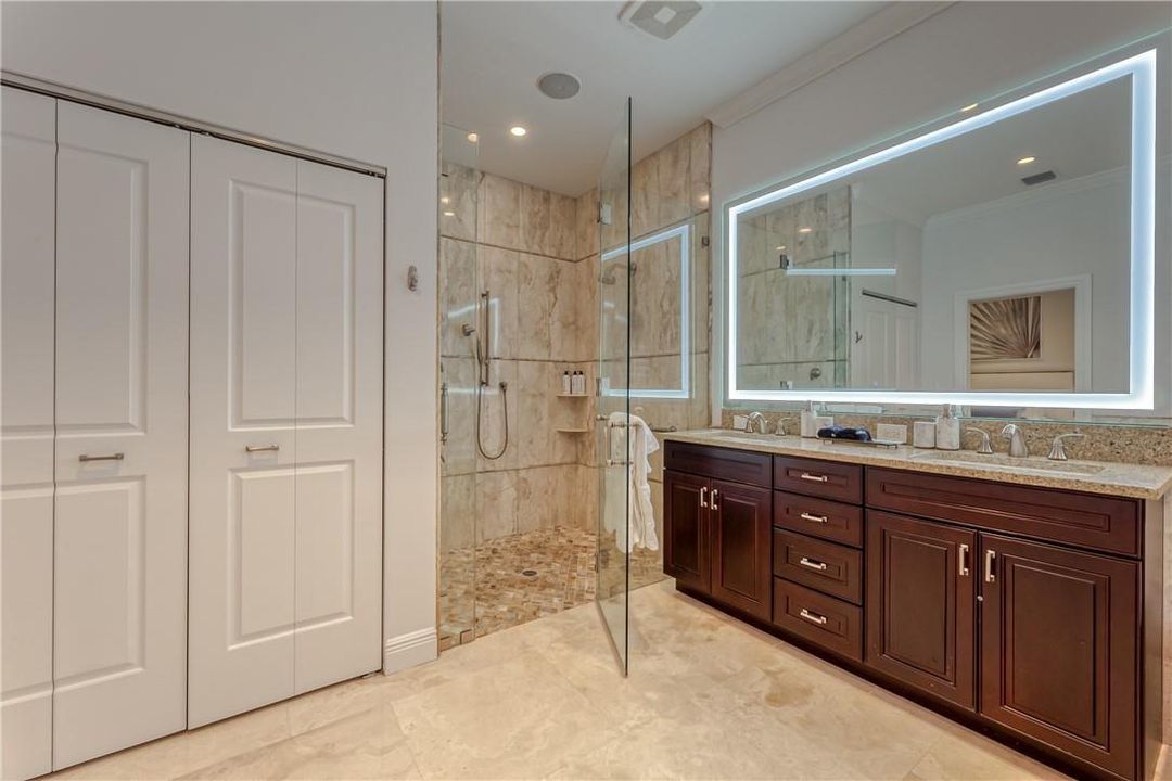 Glass door shower and his and hers sinks