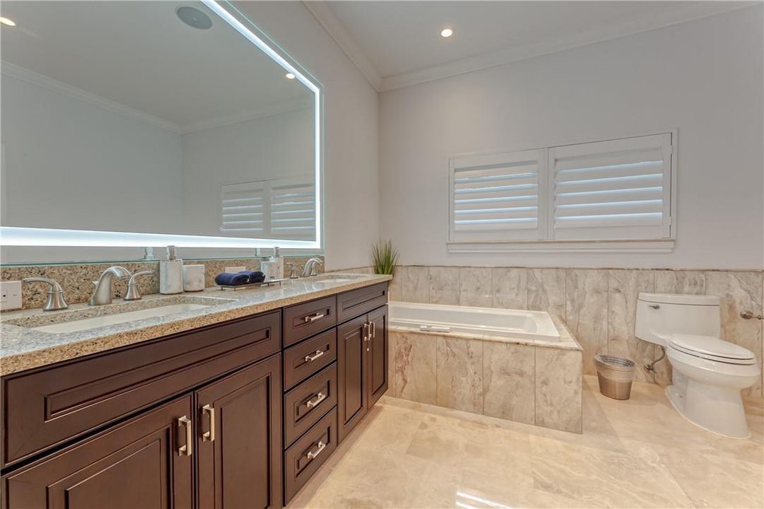 Jacuzzi tub and his and her sinks