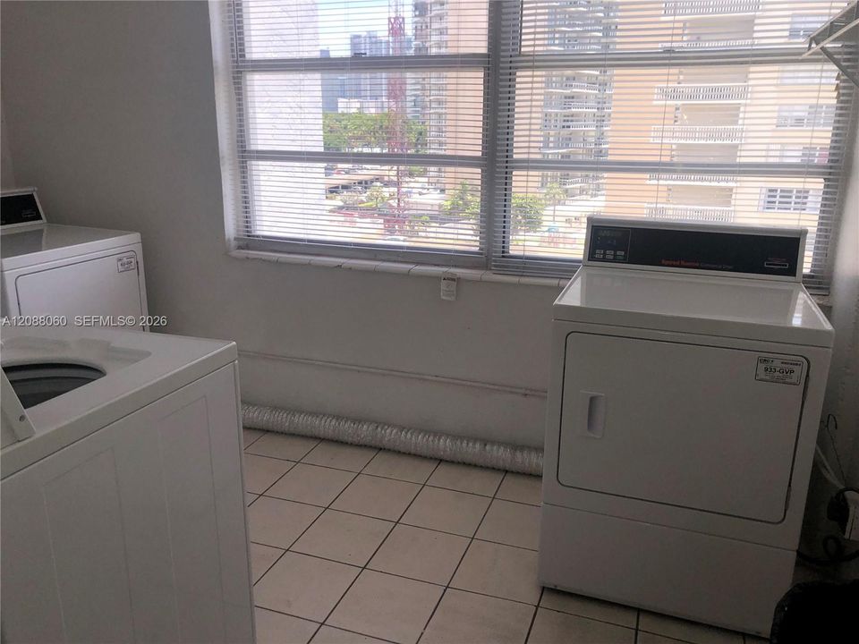 Common laundry room right around the corner from unit