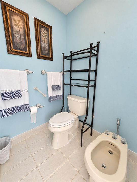 Private toilet and bidet area.