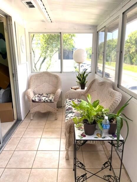 Enclosed balcony with newer windows