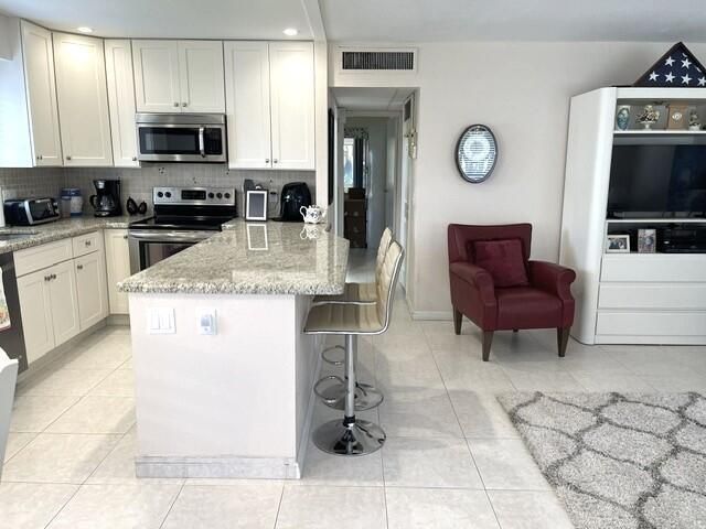 Open concept kitchen and living area vie