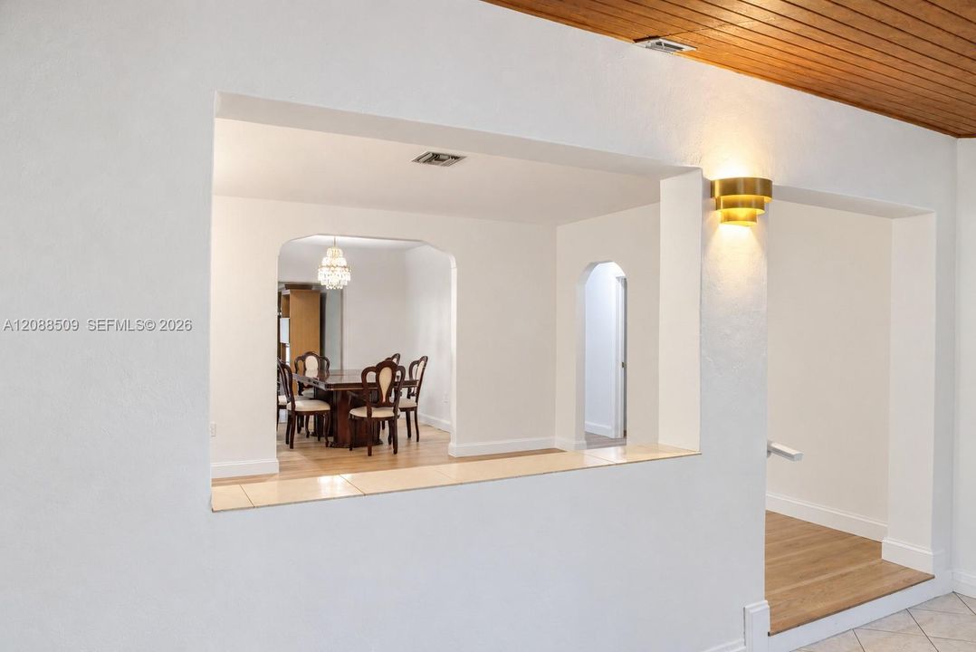 Entryway leading to bedroom with full bath