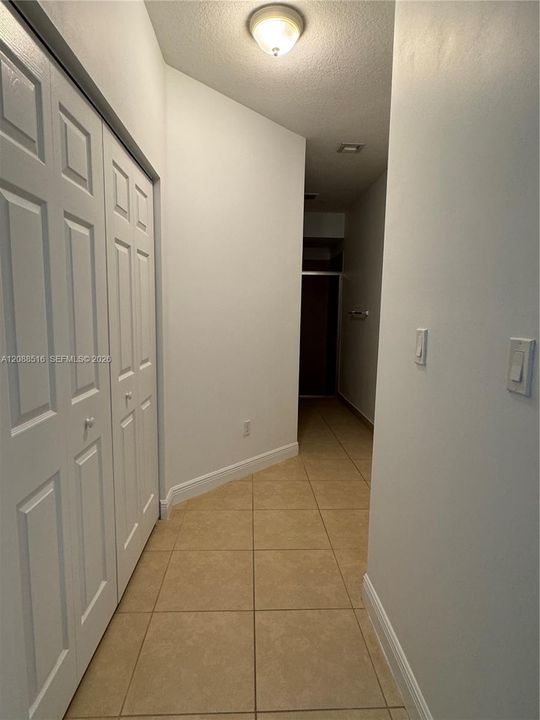 Hallway to primary bathroom