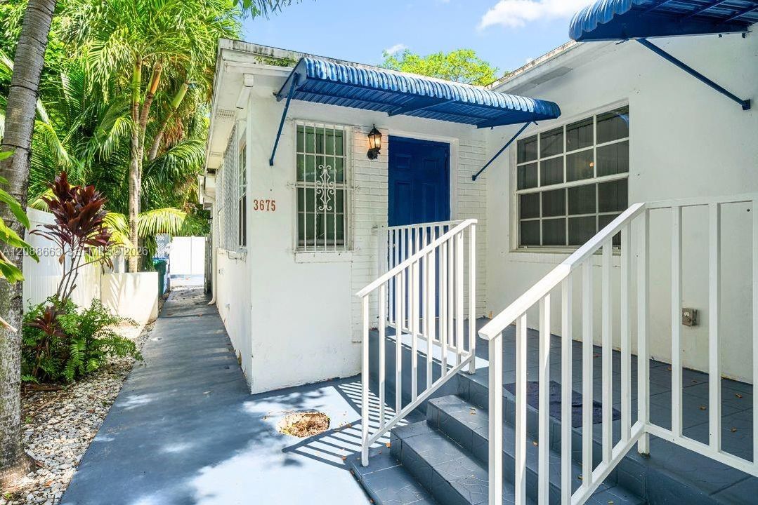 Welcoming private entrance to 3675 SW 23rd St #A, featuring covered entry steps.