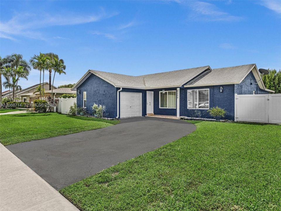 Spacious driveway accommodates multiple cars