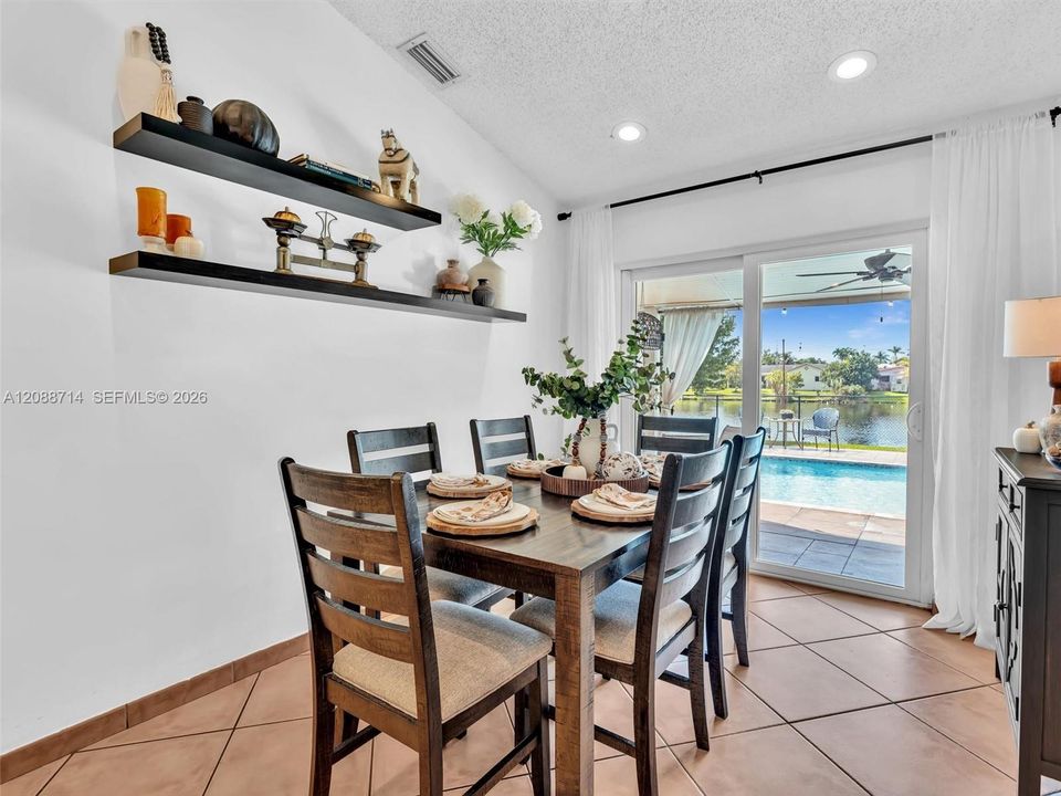 Dining room with sliders out to pool