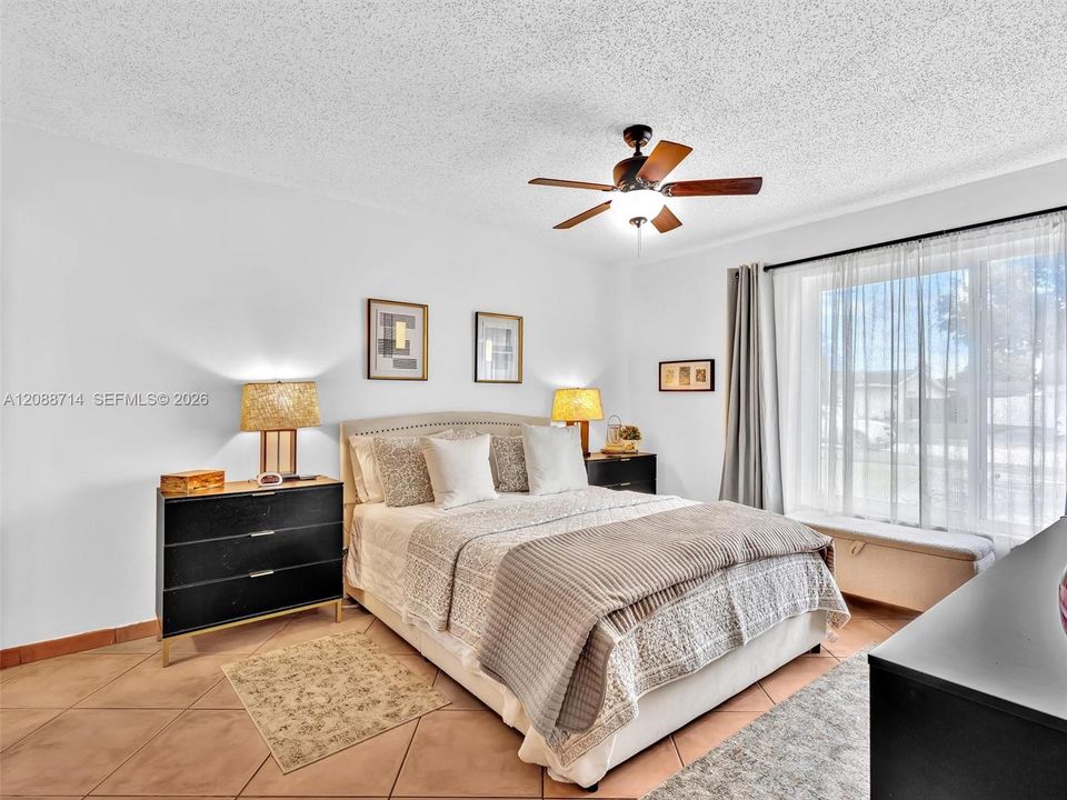 Spacious primary bedroom with huge picture window
