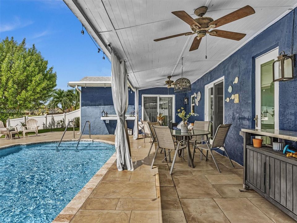 Extended covered patio with plenty of room to entertain