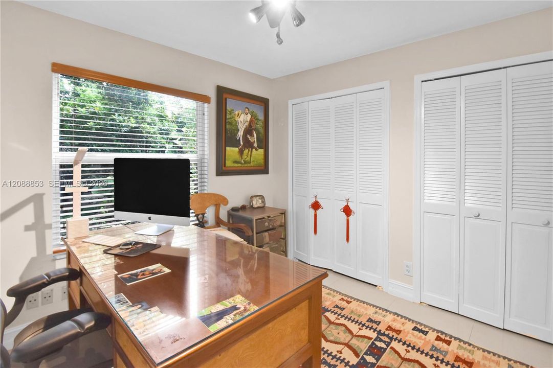 Large bedroom with french doors currently used as an office