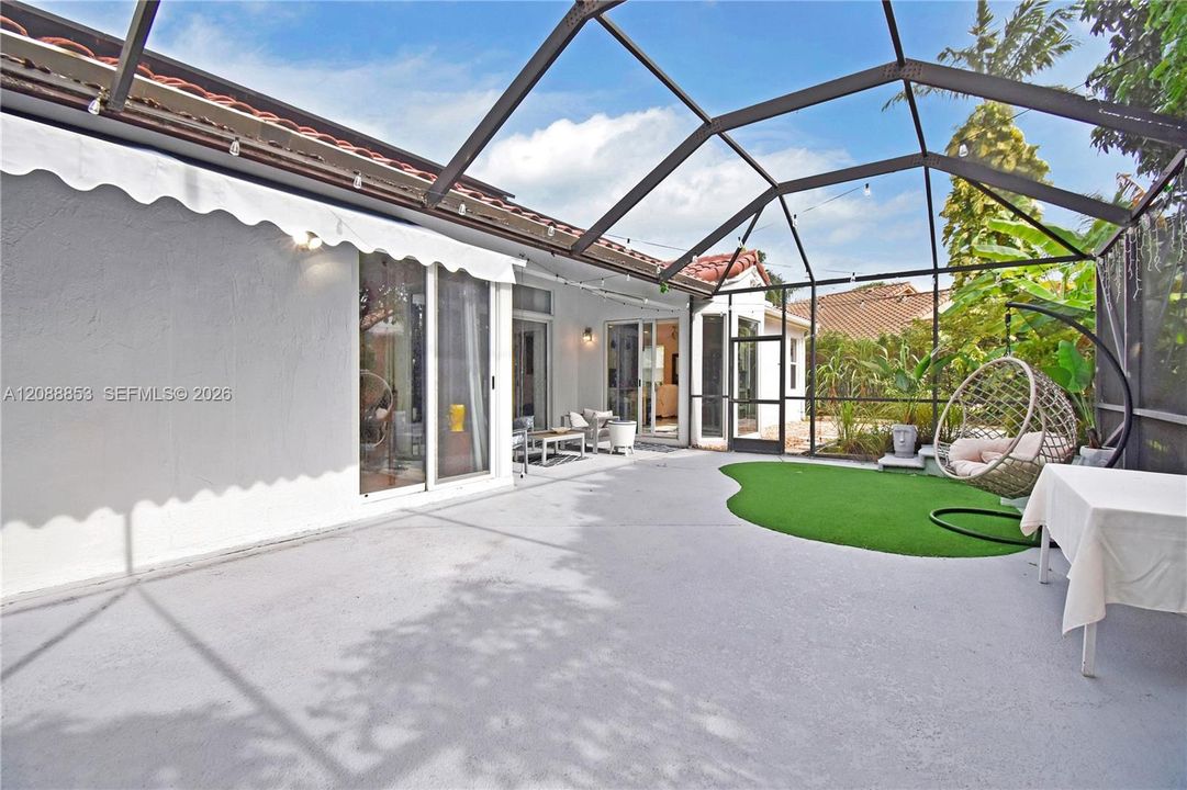 Dual adjacent patio areas providing an extended outdoor footprint