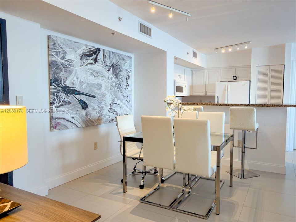 Open dining space perfect for entertaining next to the kitchen area