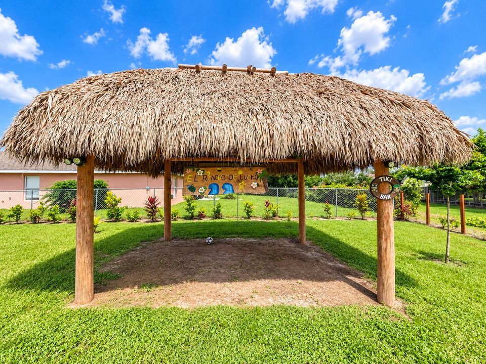 Colorful Backyard Tiki Bar Retreat
