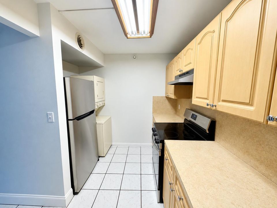 Clean Galley Kitchen with Stainless Appl