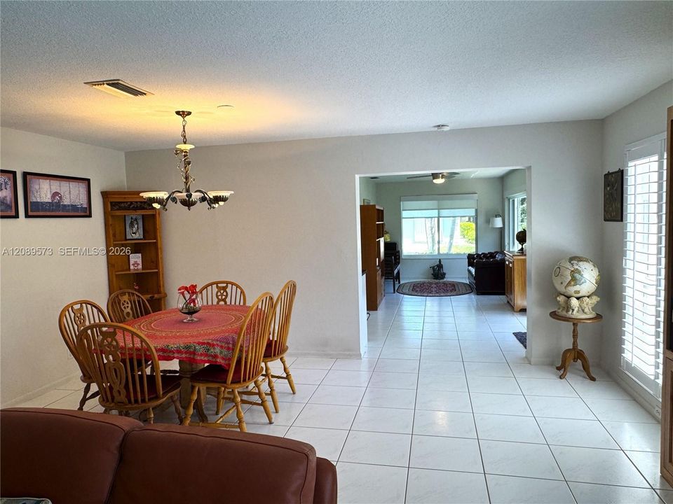 Open Concept Plan! Living Room is open to Dining Room, and open to large den/family room! Custom window treatments throughout home!