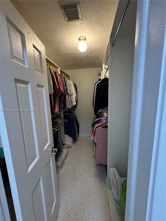 Custom shelving in primary BR walk-in closet.