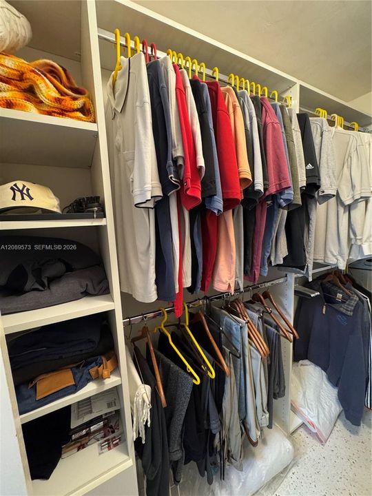 Custom shelving in primary BR walk-in closet.