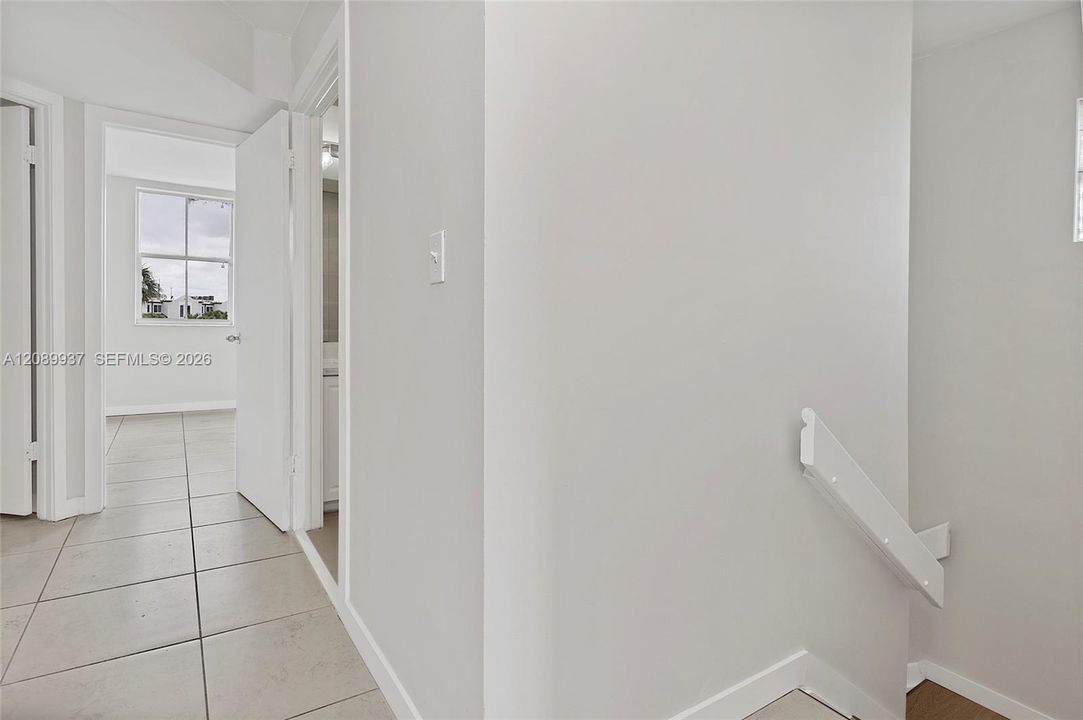 hall way to all three bedrooms