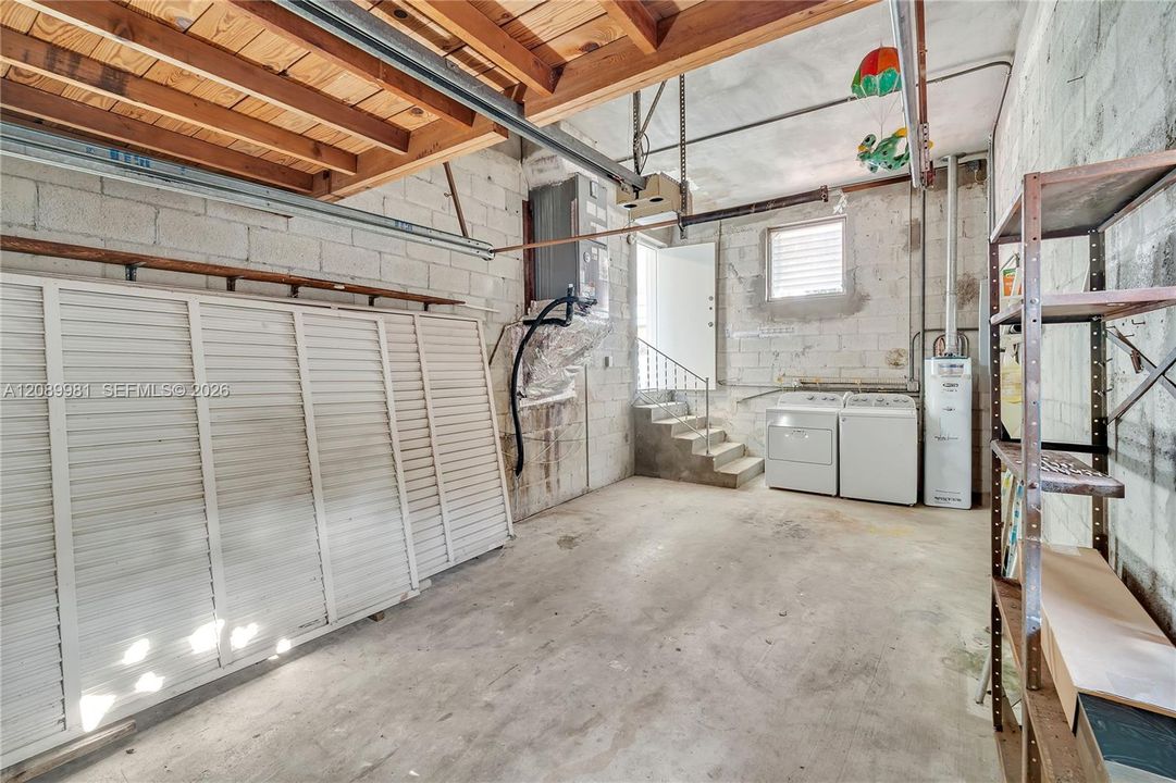 Garage with loft for extra storage.
