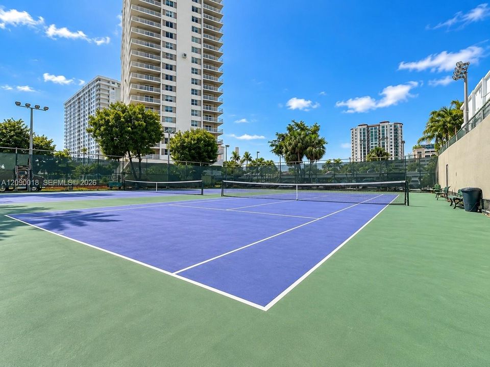 On-site tennis courts available for residents.