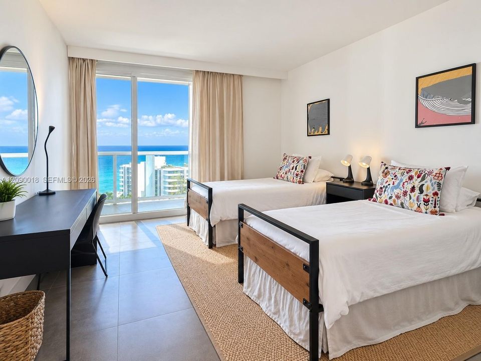 Guest bedroom outfitted with two twin beds.