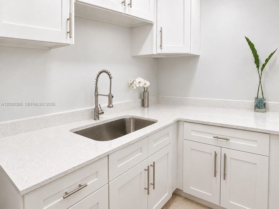 Kitchen has a two-burner portable electric cooktop, micro, fridge/freezer.