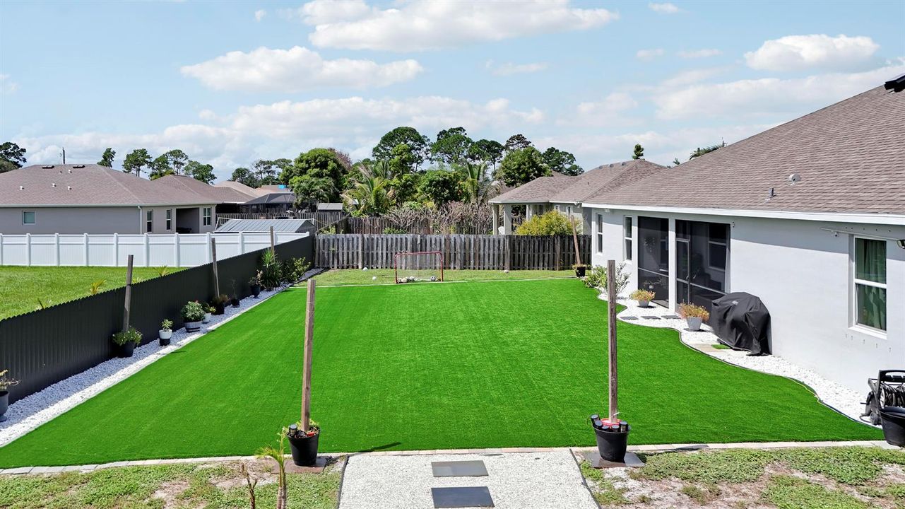 Spacious Backyard with Lush Green Lawn