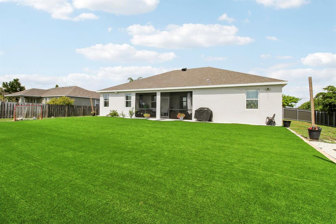 Rear Exterior and Lush Green Lawn